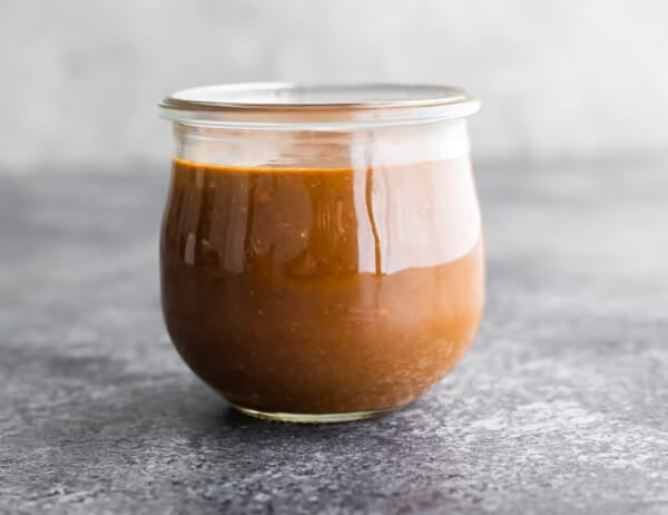 side angle of peanut sauce in jar