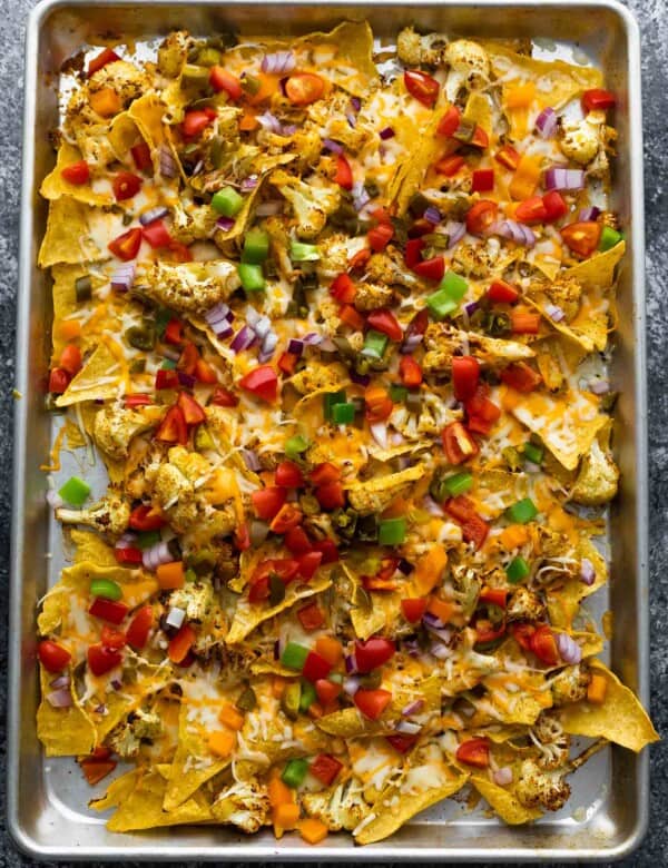 cauliflower nachos on sheet pan after melting