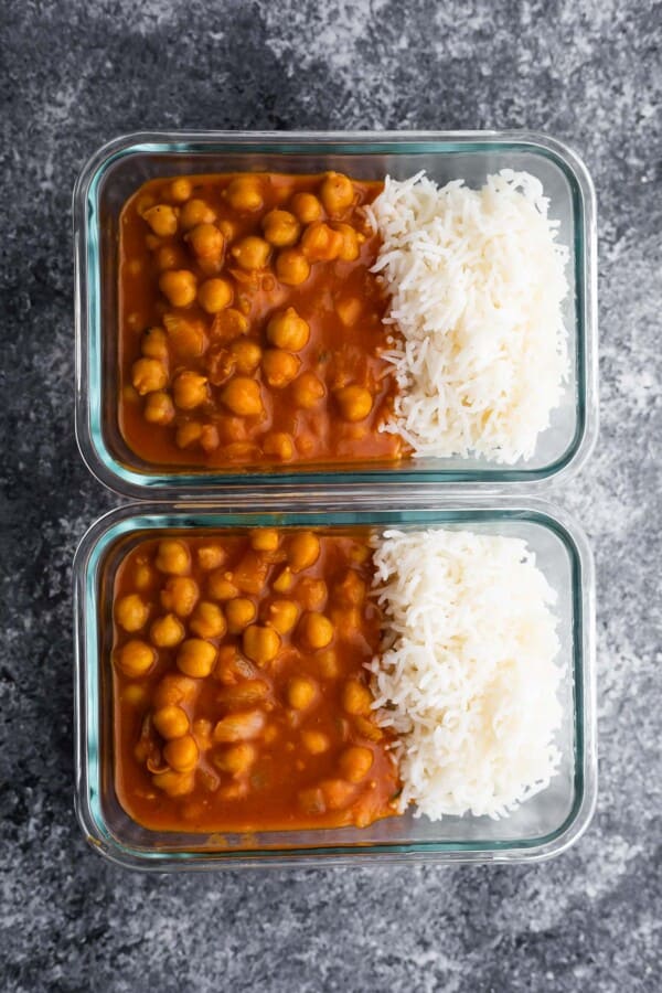chickpea curry portioned out with rice in two meal prep containers