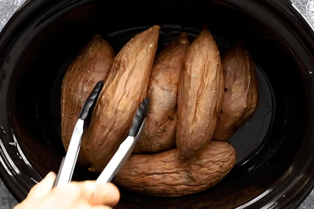 sweet potatoes in the slow cooker after cooking through
