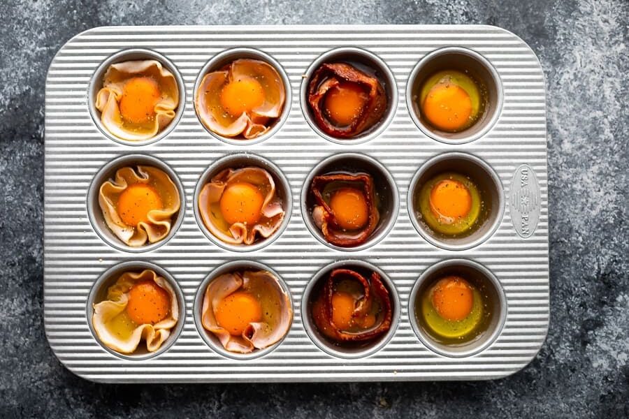 oven baked eggs in muffin tin before baking
