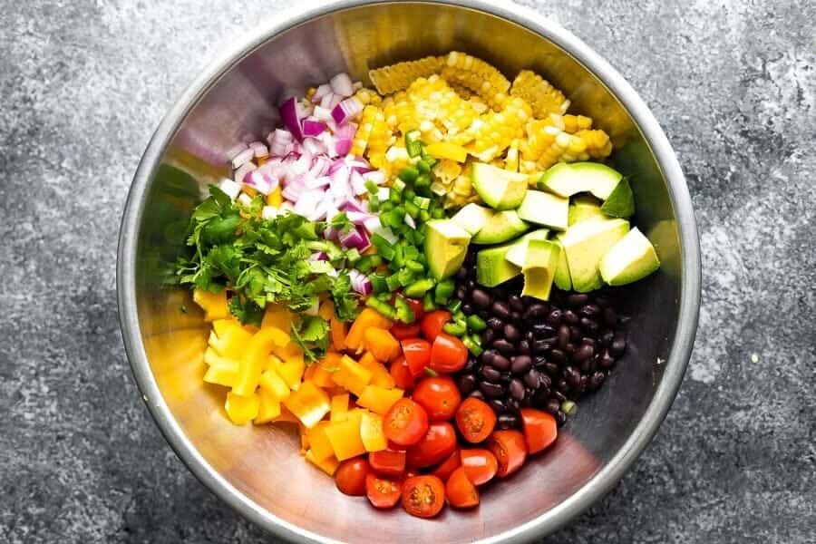 overhead shot of the black bean and corn salad recipe in bowl before tossing