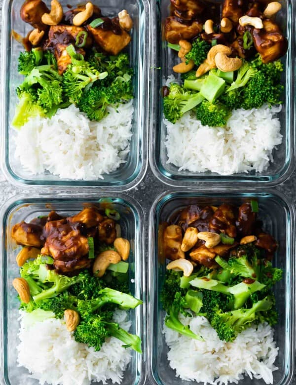 cashew chicken portioned out with rice and broccoli in meal prep containers