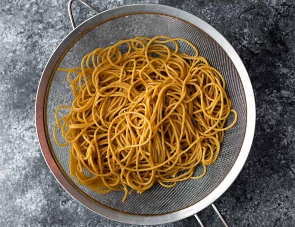 whole wheat spaghetti in strainer