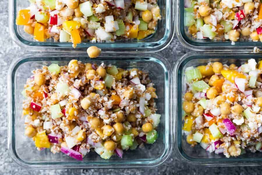 bulgur salad divided between four meal prep containers