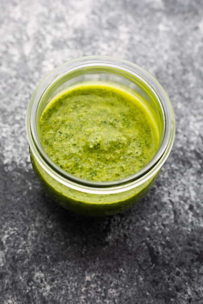 Classic Basil Pesto closeup shot in glass mason jar