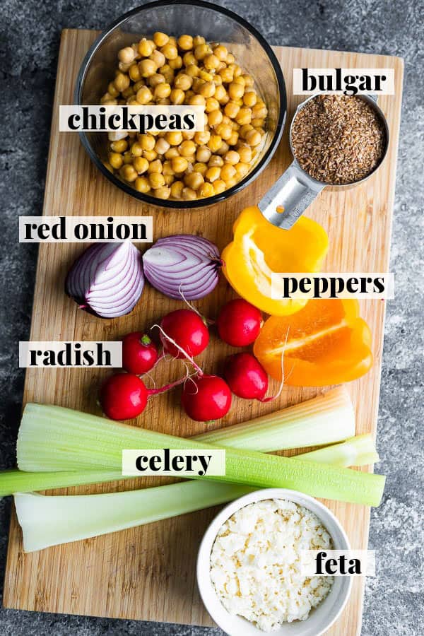 overhead view of chickpea salad recipe ingredients on cutting board
