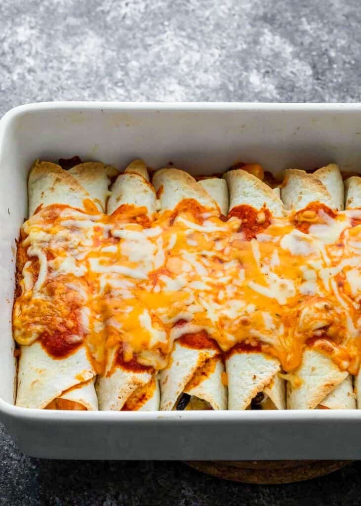 a casserole dish fill of enchiladas