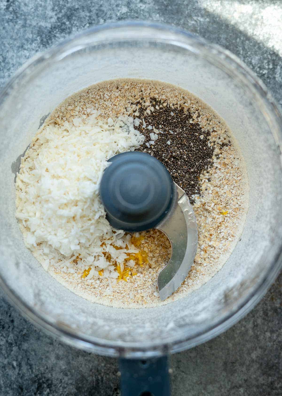 ingredients for lemon protein bars in a food processor 