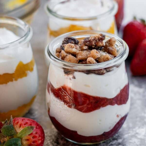 greek yogurt, homemade fruit sauce, and nuts in a parfait jar for the perfect light snack