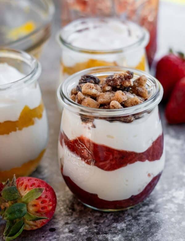 greek yogurt, homemade fruit sauce, and nuts in a parfait jar for the perfect light snack