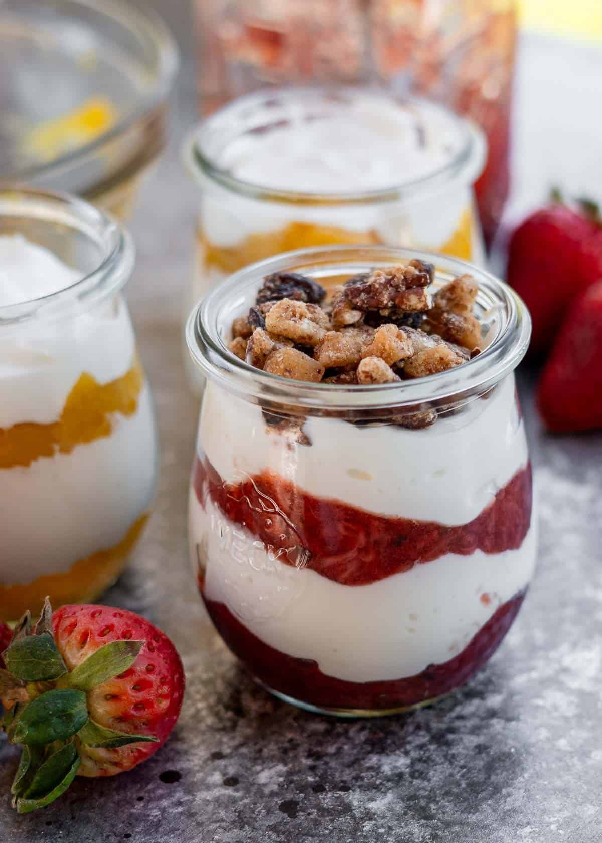 greek yogurt, homemade fruit sauce, and nuts in a parfait jar for the perfect light snack