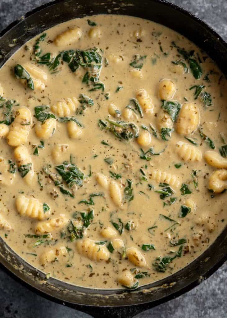 pesto gnocchi in a skillet