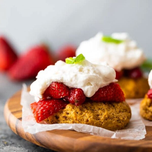 a closeup shot of strawberry shortcake with whipped cream