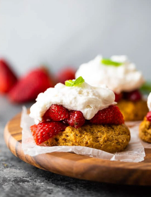 a closeup shot of strawberry shortcake with whipped cream