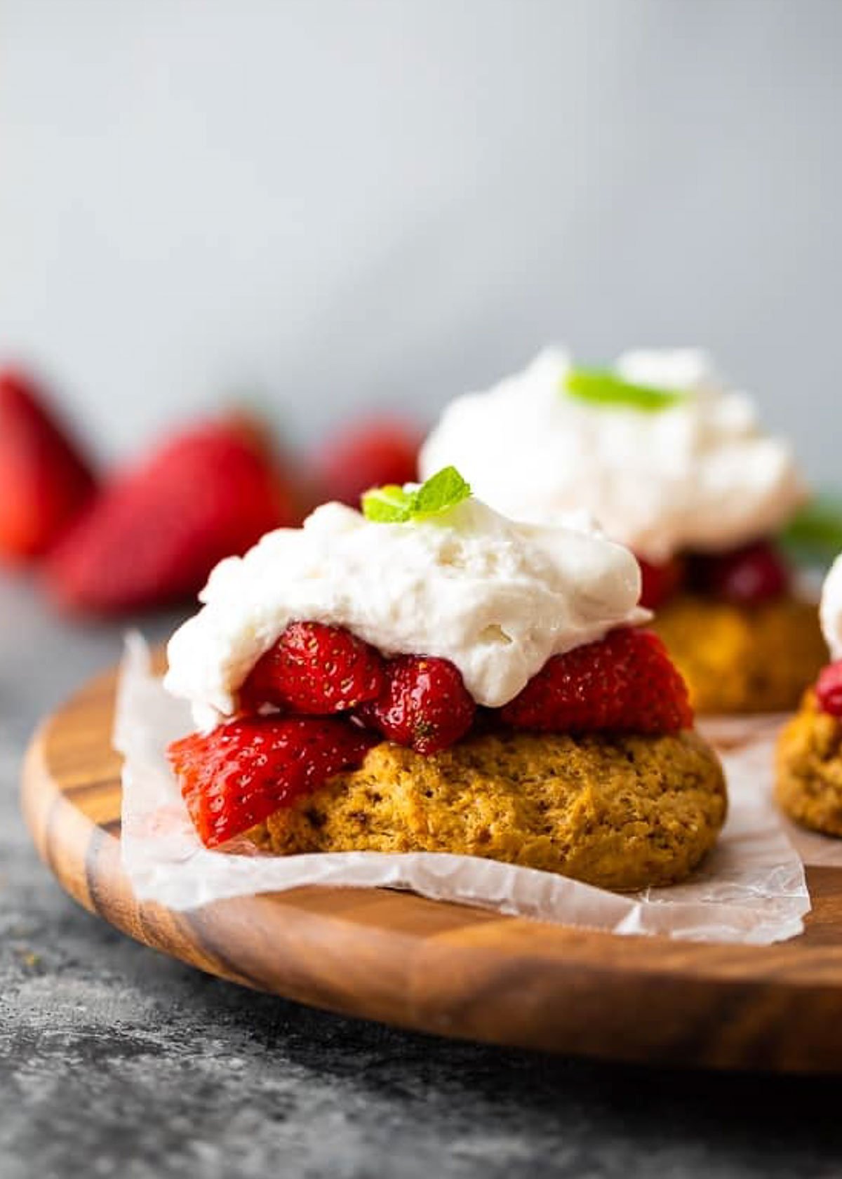 a closeup shot of strawberry shortcake with whipped cream