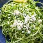 cucumber salad with feta and lemon wedges