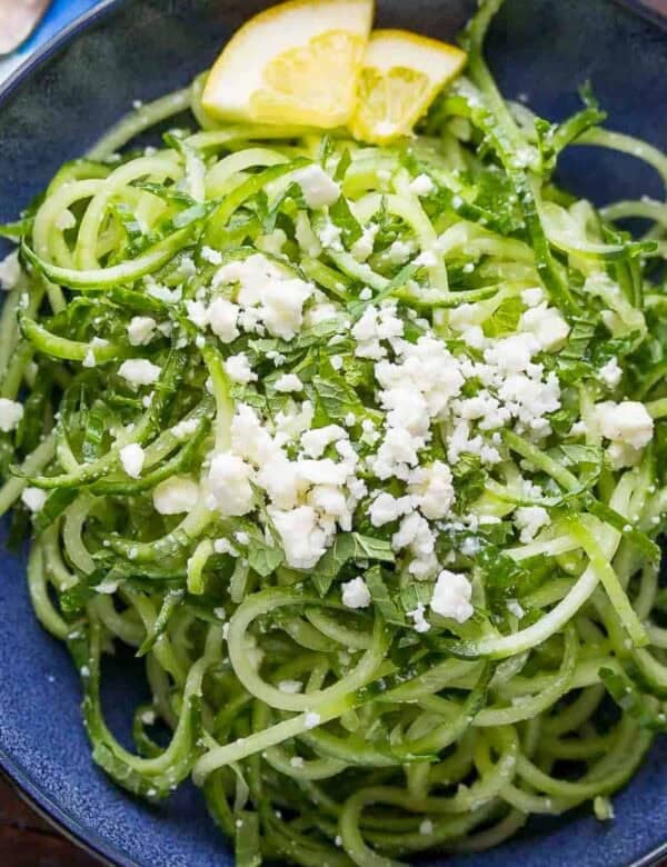 cucumber salad with feta and lemon wedges