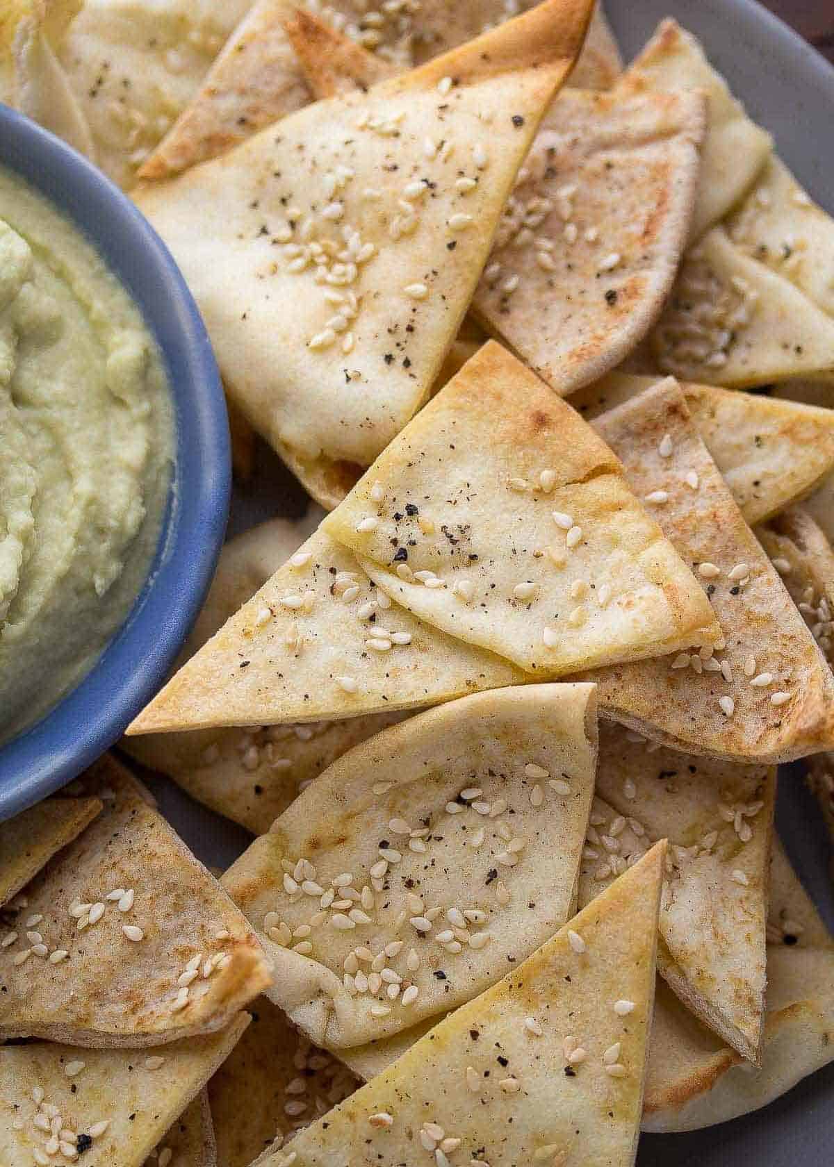 closeup on crispy pita chips baked with sesame flavor