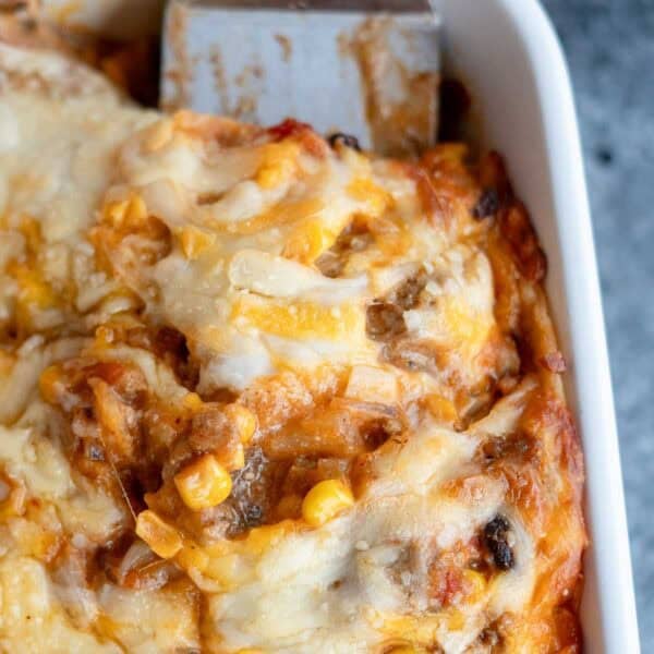 a close up shot of a slice of taco casserole