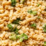 creamy broccoli parmesan pasta in a black skillet