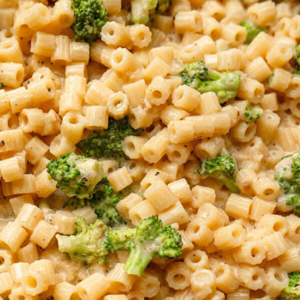 creamy broccoli parmesan pasta in a black skillet