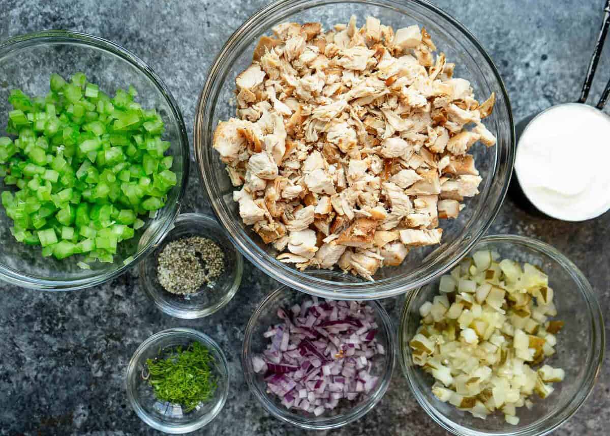 all ingredients needed for dill pickle chicken salad recipe on a countertop