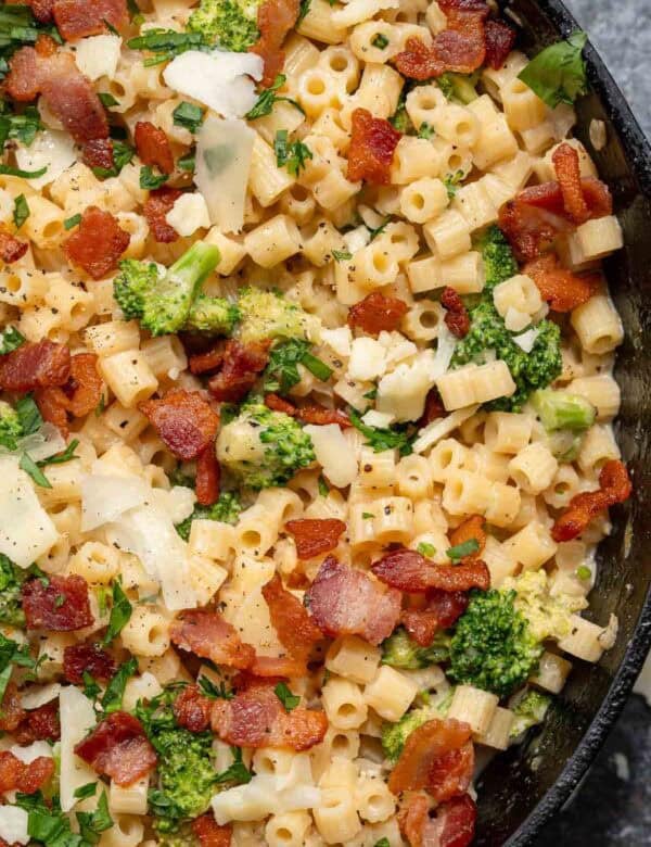 an overhead shot of ditalini pasta with broccoli, bacon and parmesan
