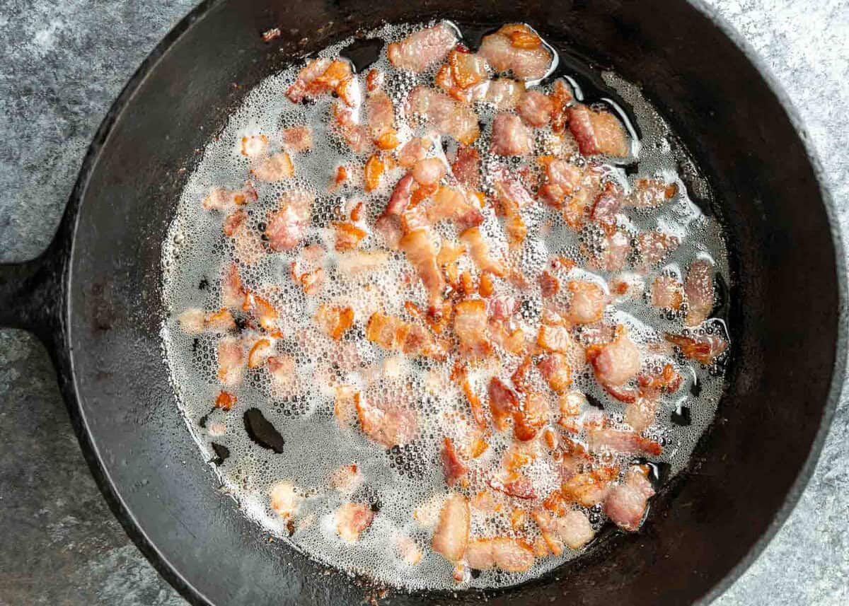 an overhead shot of bacon in a skillet
