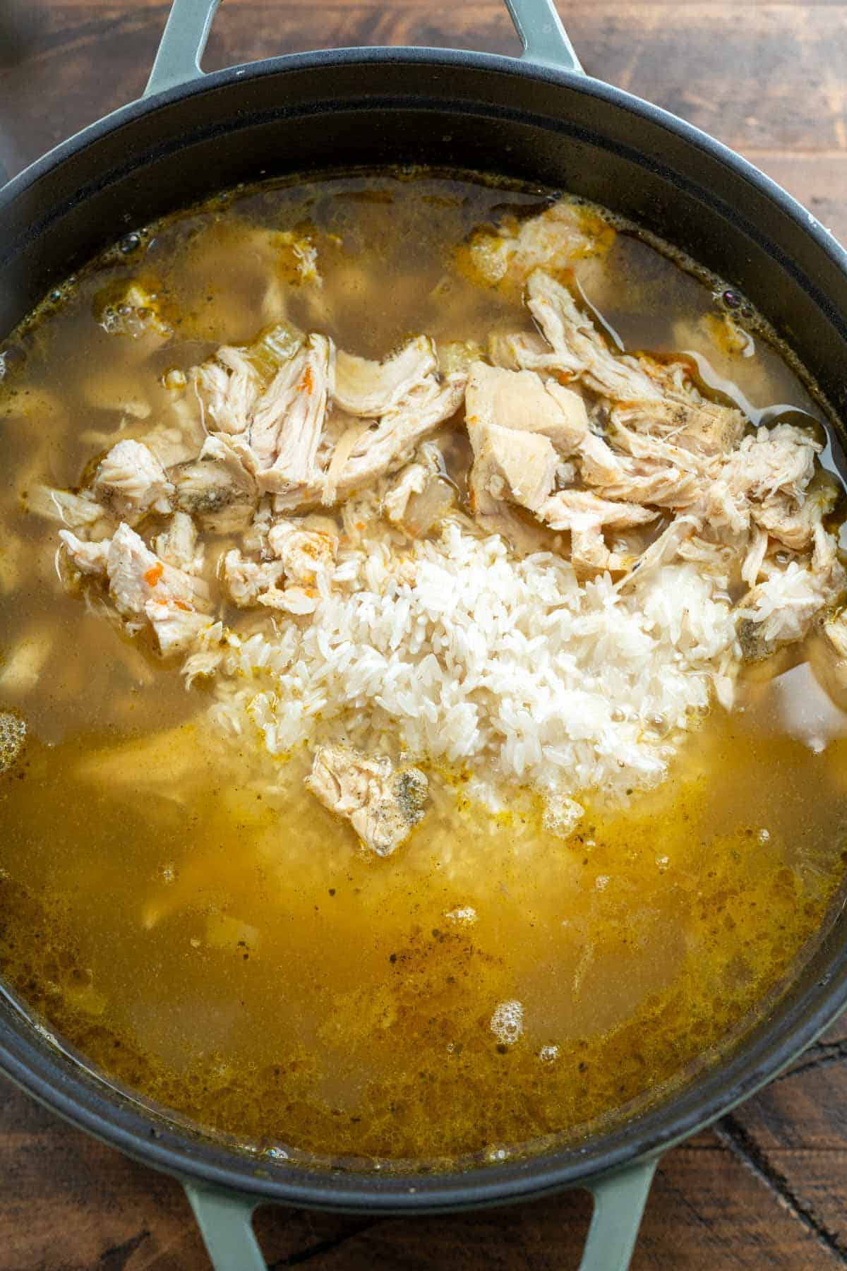 chicken and rice soup ingredients in a black pot