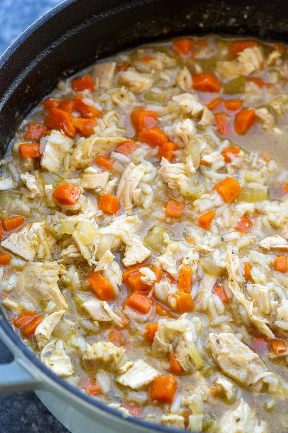 cooked chicken and rice soup in a pot