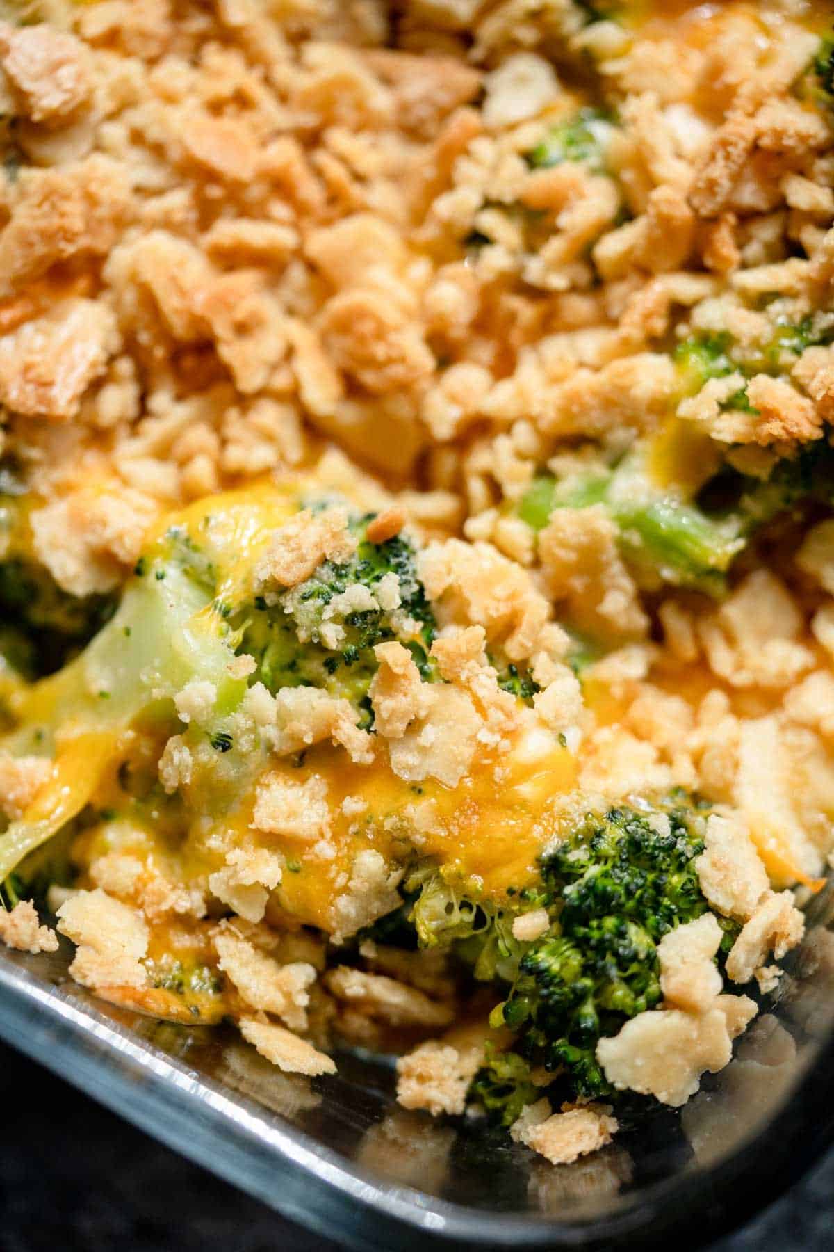 a closeup of broccoli cheese casserole with butter crackers on top