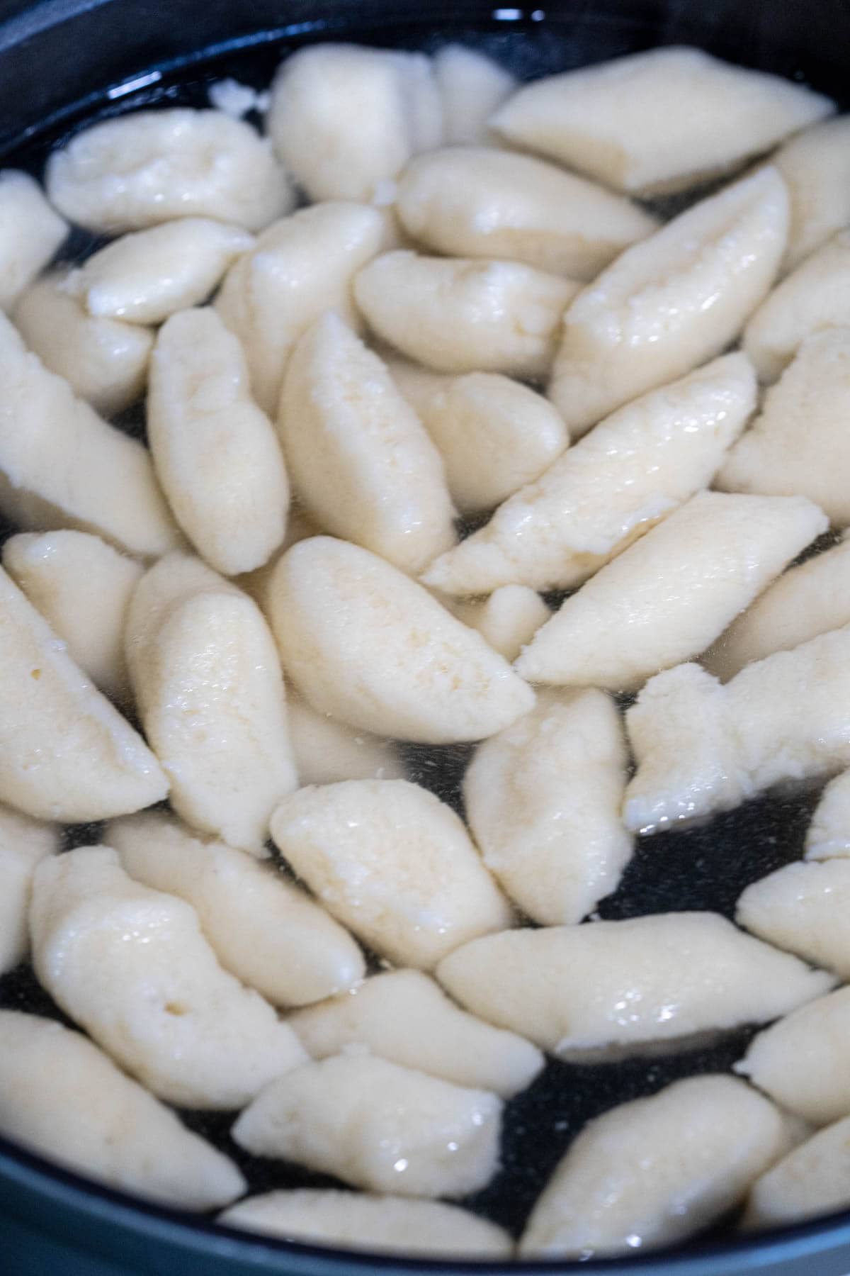 boiling gnocchi floating in a pot