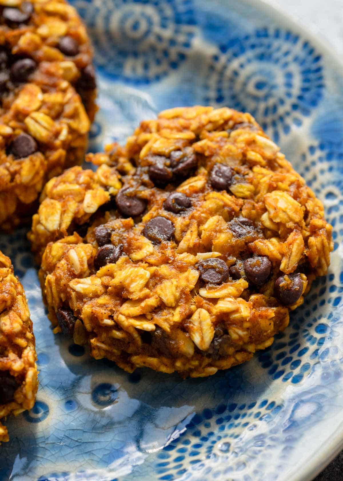 a closeup of pumpkin spice breakfast cookies on a blue plate