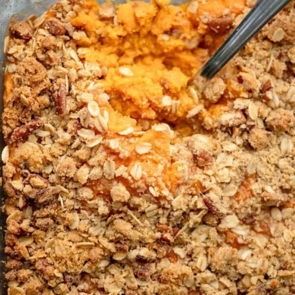 an overhead shot of sweet potato casserole with a spoon