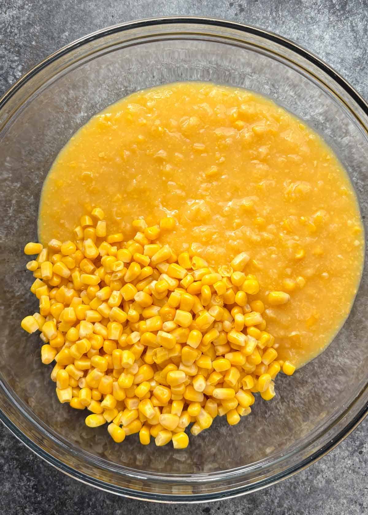 corn casserole ingredients in a glass dish