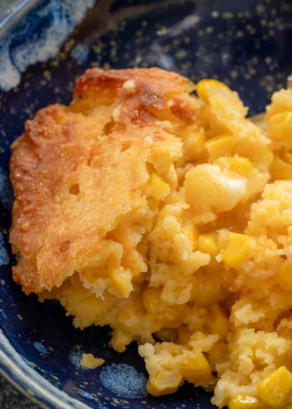 corn casserole in a blue bowl