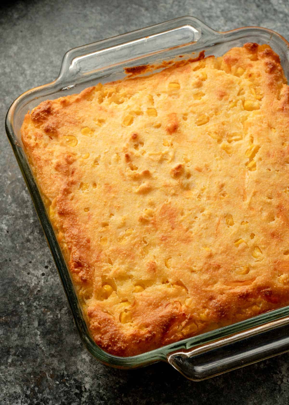 cooked cornbread casserole in a glass dish