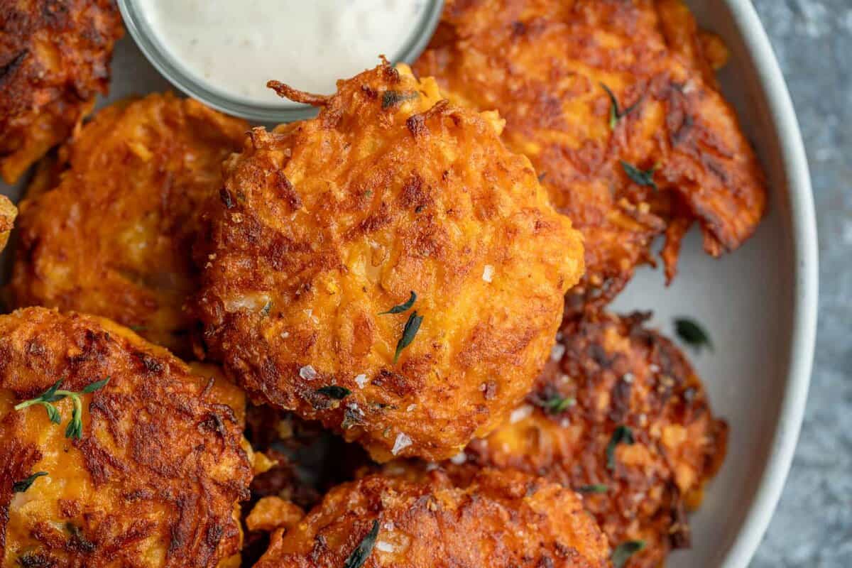a close up shot of butternut squash fritters