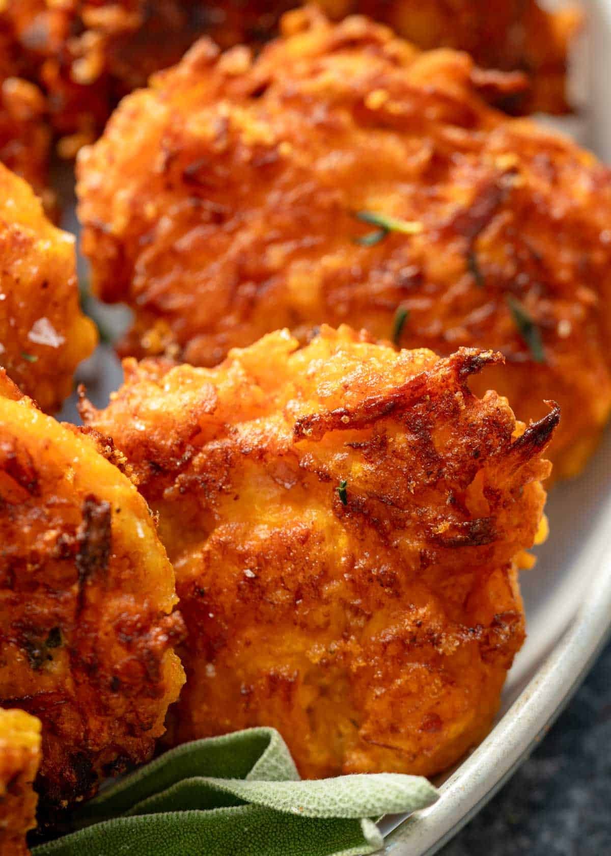 close up image of butternut squash fritters that have been cooked