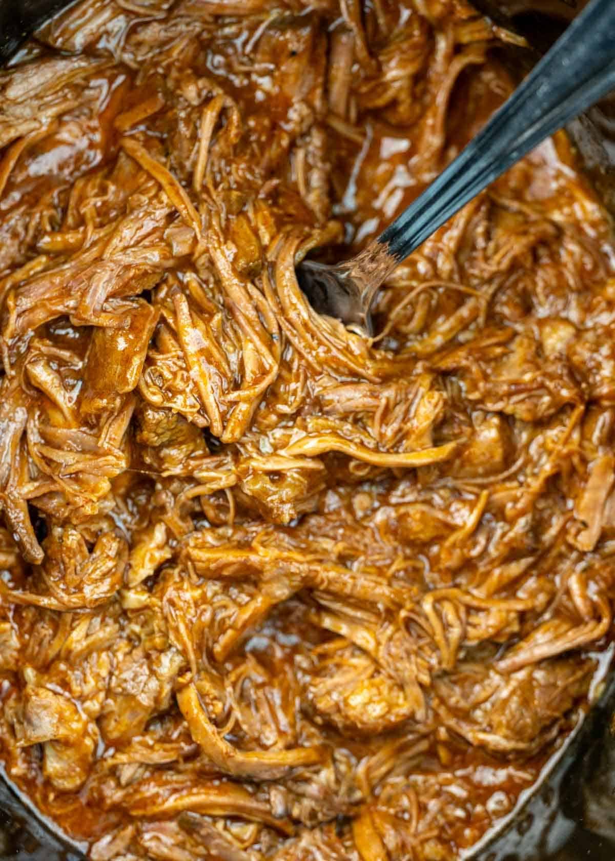 a crockpot full of shredded beef for tacos