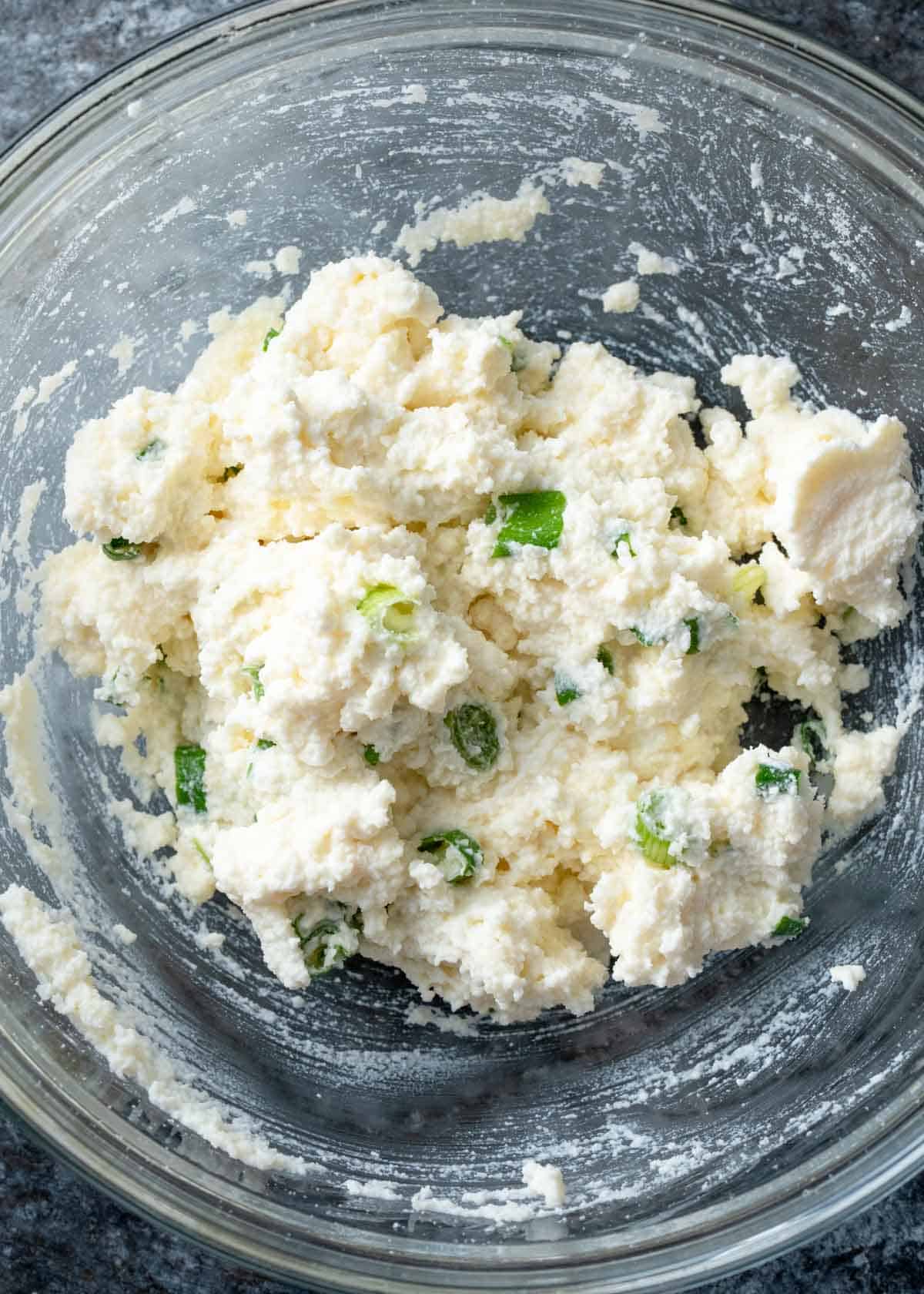 ricotta mixture with parmesan, chives, and garlic in a bowl