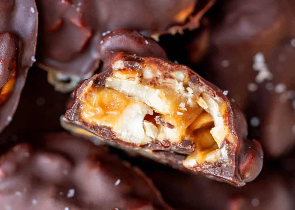 a very closeup shot of a caramel cashew cluster