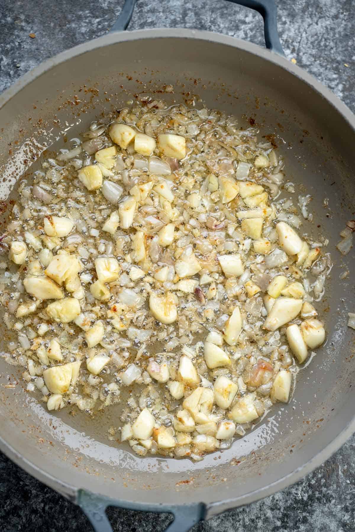 garlic and shallots in a skillet