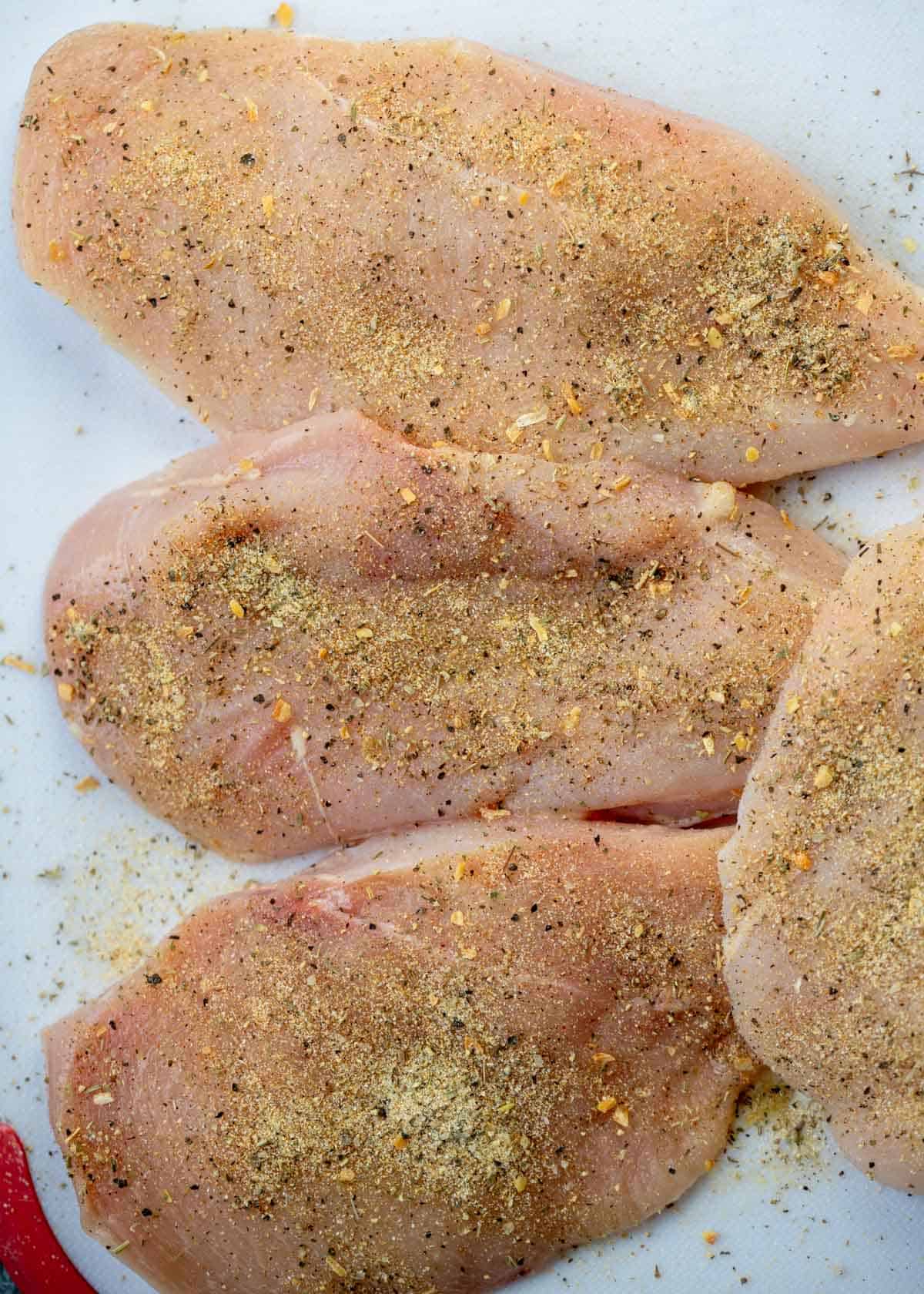 seasoned chicken on a cutting board