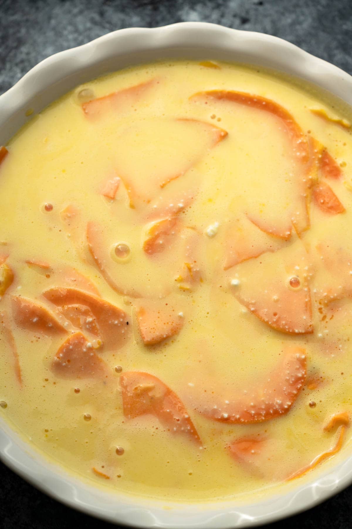 egg mixture over sweet potatoes