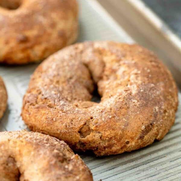 close up, angled image of cinnamon bagel on sheet pan