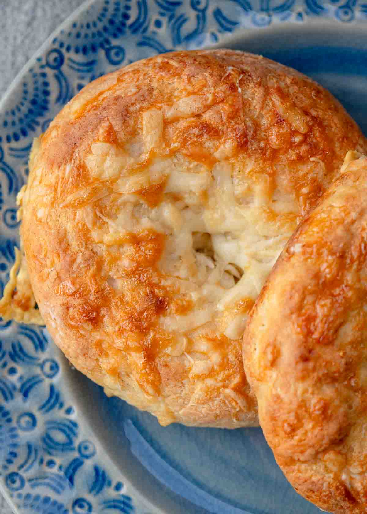 high protein bagels with cottage cheese on a blue plate