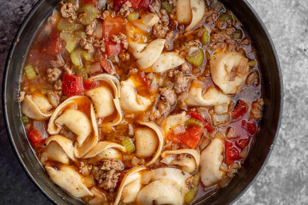overhead shot of tortellini sausage soup