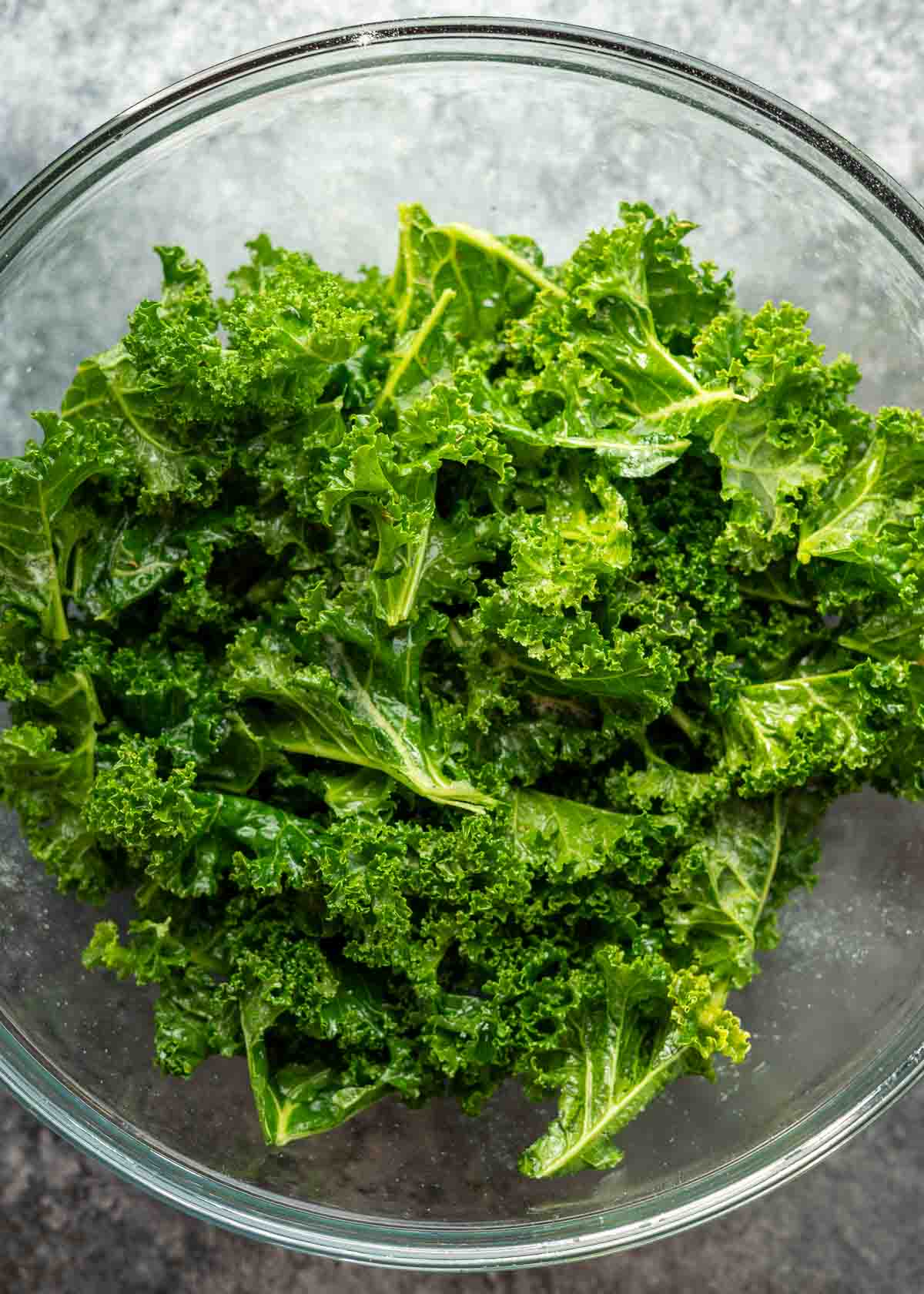 fresh kale in a clear mixing bowl